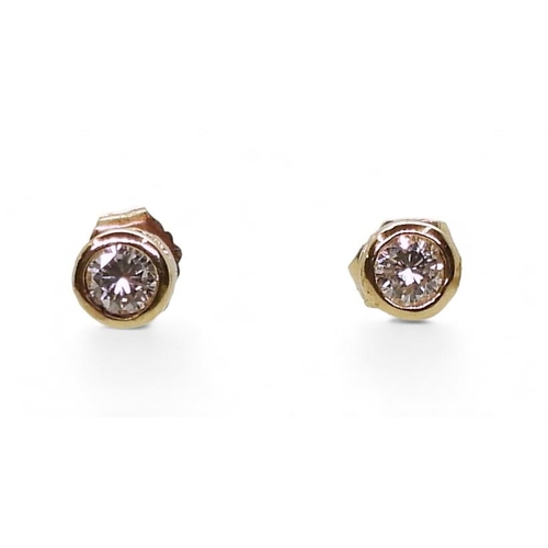 771 - A pair of 14k gold diamond stud earrings of estimated approx 0.30cts combined, weight 1gm