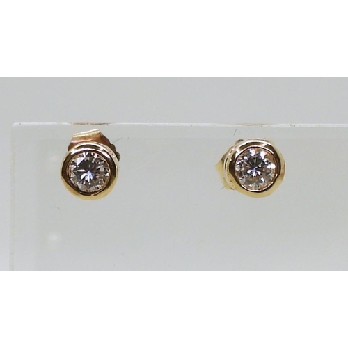 771 - A pair of 14k gold diamond stud earrings of estimated approx 0.30cts combined, weight 1gm