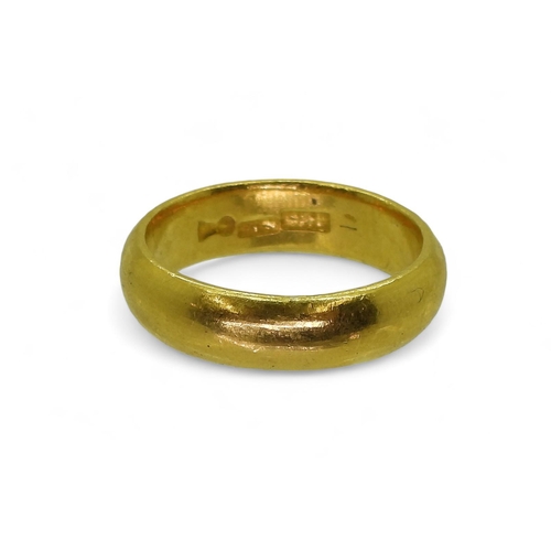 772 - A bright yellow metal wedding ring, stamped with Chinese characters, size X1/2, weight 15.2gms