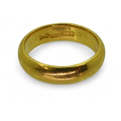 772 - A bright yellow metal wedding ring, stamped with Chinese characters, size X1/2, weight 15.2gms