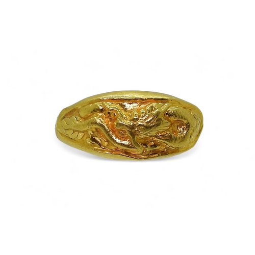 773 - A bright yellow metal dragon ring, stamped with Chinese characters, and 96.5%, size R1/2, weight 3.7... 