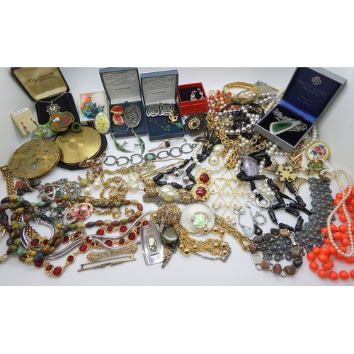 934 - A large collection of costume jewellery in a blue cargo style box, a Foxhunting pattern compact, Art... 