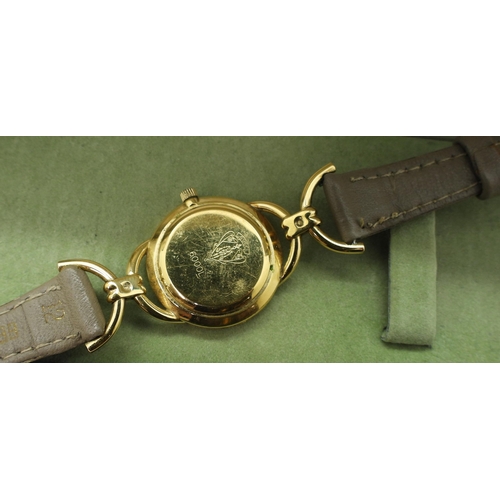 944 - A ladies gold plated Gucci watch number 6000L with serial number 0100476, with box and point of sale... 