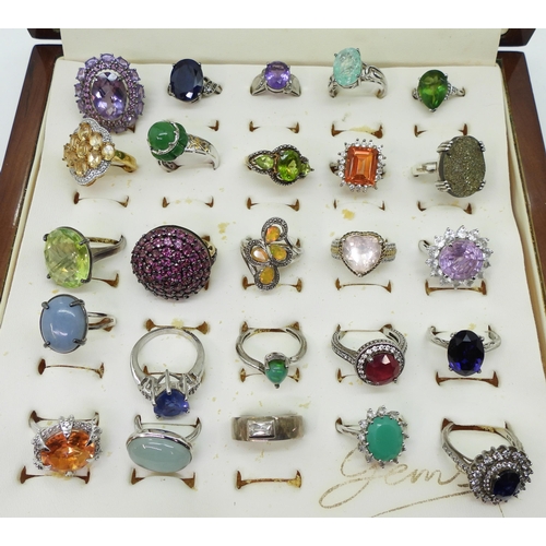 948 - Twenty two silver gem set rings to include, amethyst, treated sapphire and ruby, and a peridot three... 