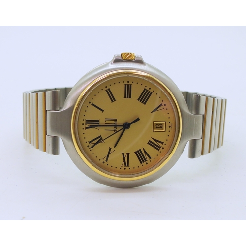 948B - A gents stainless steel Dunhill wristwatch with gold plated details. A gold coloured dial with date ... 