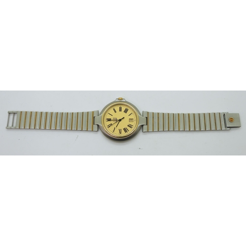 948B - A gents stainless steel Dunhill wristwatch with gold plated details. A gold coloured dial with date ... 