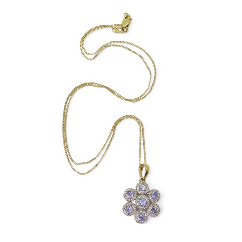 753 - A 9ct gold QVC diamond and blue gem flower pendant length of pendant with bail, 2.6cm, with a fine 4... 