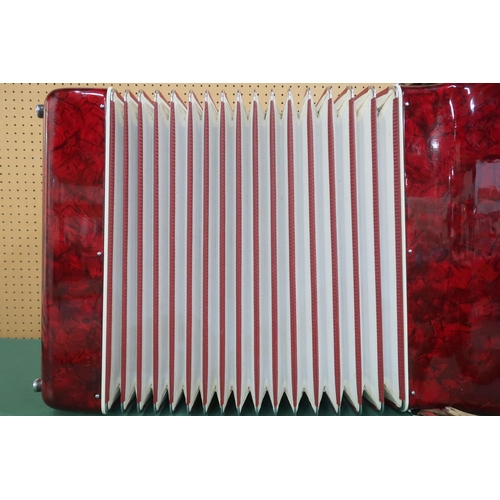 433 - An Italian Concordia Double Forte 120 bass 41 key piano accordion in red and golden glitter with cla... 