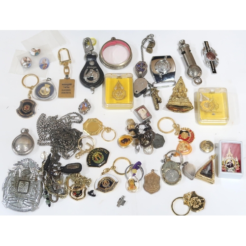 635 - A lot comprising various amulets, jewellery loops, police whistles etc