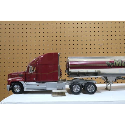 636 - Two Mack Trucks by the Franklin Mint,  with boxes for each trailer (2)