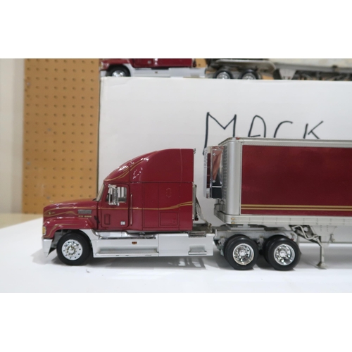 636 - Two Mack Trucks by the Franklin Mint,  with boxes for each trailer (2)