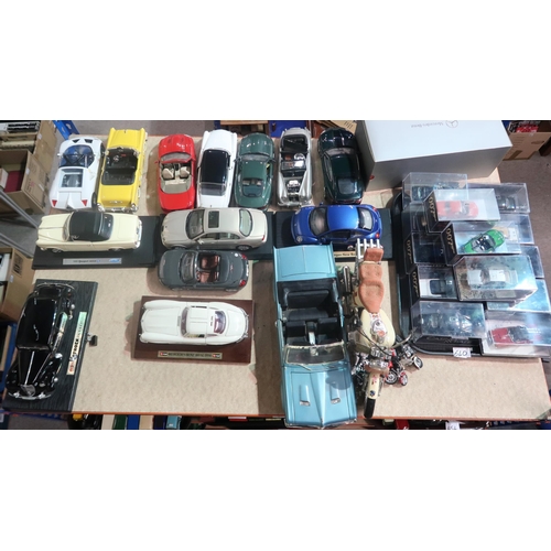 640 - A mixed collection of diecast scale model cars, to include examples by Maisto, Burago, Ertl etc., al... 