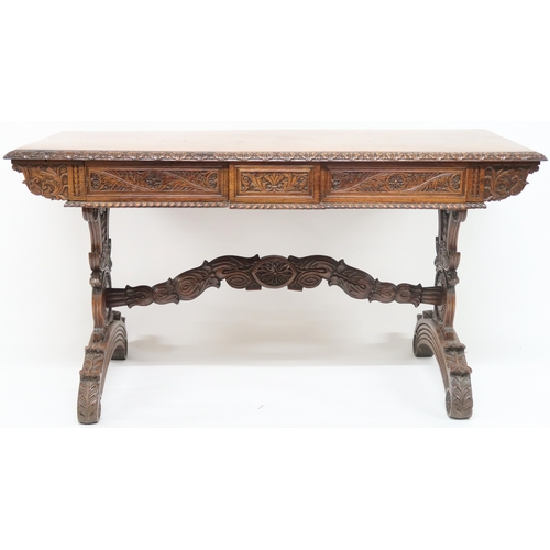 2000 - A 19TH CENTURY ANGLO-INDIAN LIBRARY TABLE rectangular top with carved foliate edges over pair of asy... 