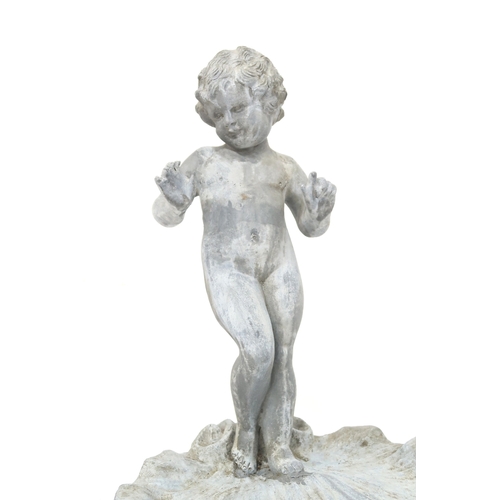 2001 - A LATE 19TH/EARLY 20TH CENTURY LEAD CHERUB BIRD BATHwith cherubim figure standing on scalloped shell... 