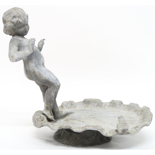 2001 - A LATE 19TH/EARLY 20TH CENTURY LEAD CHERUB BIRD BATHwith cherubim figure standing on scalloped shell... 