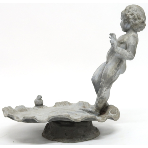 2001 - A LATE 19TH/EARLY 20TH CENTURY LEAD CHERUB BIRD BATHwith cherubim figure standing on scalloped shell... 