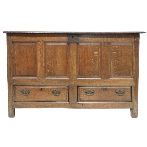 2007 - AN 18TH CENTURY OAK PANEL FRONT KIST with rectangular hinged top over panelled front over pair of dr... 