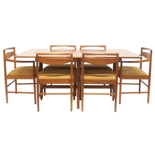 2104 - A MID 20TH CENTURY TEAK A.H MCINTOSH & CO LTD OF KIRKCALDY TEAK EXTENDING DINING TABLE AND SIX C... 