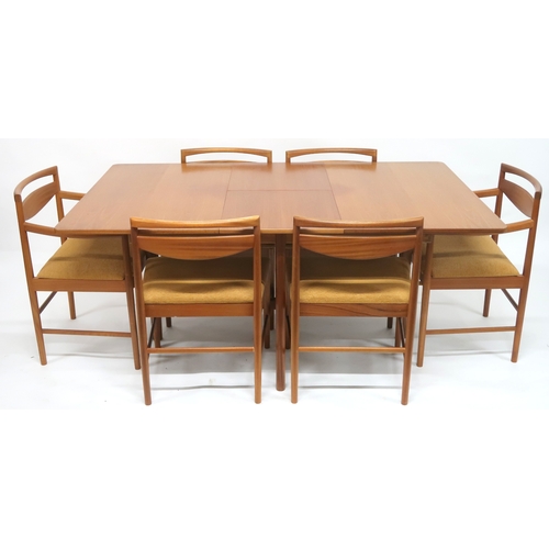 2104 - A MID 20TH CENTURY TEAK A.H MCINTOSH & CO LTD OF KIRKCALDY TEAK EXTENDING DINING TABLE AND SIX C... 