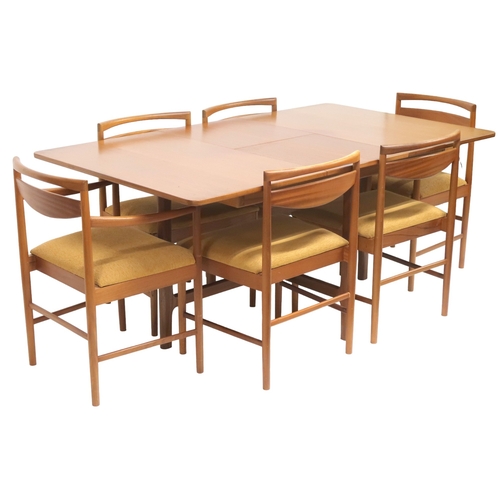 2104 - A MID 20TH CENTURY TEAK A.H MCINTOSH & CO LTD OF KIRKCALDY TEAK EXTENDING DINING TABLE AND SIX C... 