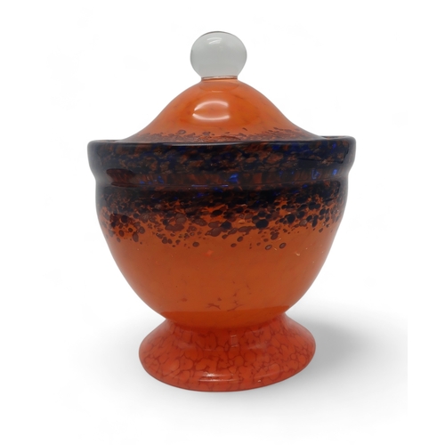 2207 - A MONART POT AND COVERin orange, blue and aventurine, cased in clear glass, with ball shaped handle,... 