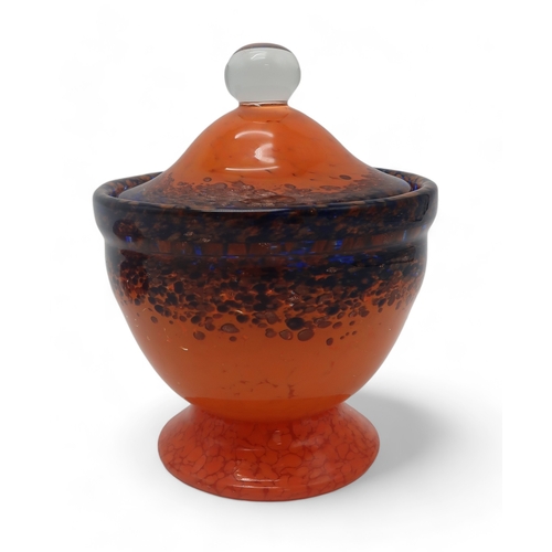 2207 - A MONART POT AND COVERin orange, blue and aventurine, cased in clear glass, with ball shaped handle,... 