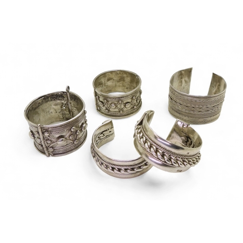 892 - Collection of North African white metal bangles, possibly Sudanese, some hallmarks