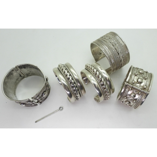 892 - Collection of North African white metal bangles, possibly Sudanese, some hallmarks