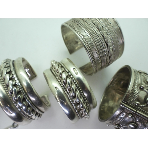 892 - Collection of North African white metal bangles, possibly Sudanese, some hallmarks