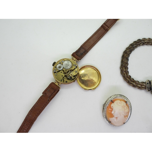 895 - A 9ct gold ladies watch head, together with a Silver bracelet, a large white metal locket with a bir... 