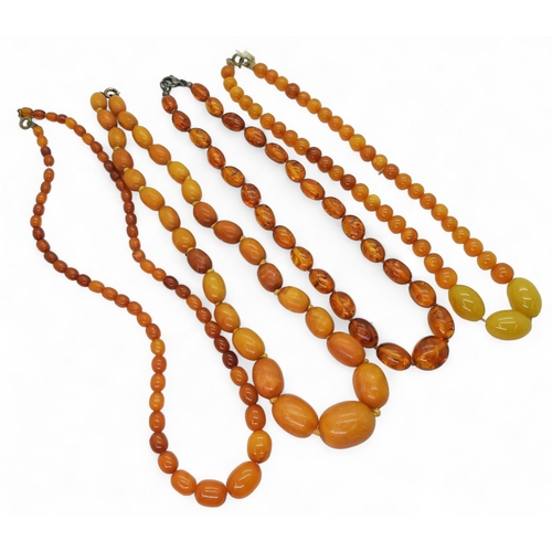 897 - Four strings of yellow Amber beads