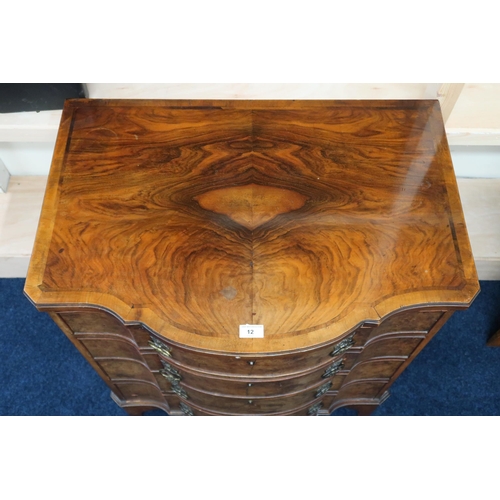 12 - A 19th century walnut veneered serpentine front four drawer chest on bracket feet, 86cm high x 77cm ... 