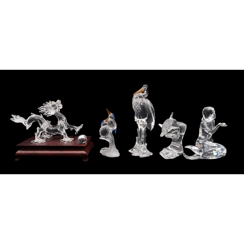 A collection of Swarovski crystal including a Heron, kingfishers, Zodiac dragon, a mermaid and dolphin