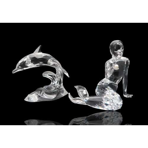 225 - A collection of Swarovski crystal including a Heron, kingfishers, Zodiac dragon, a mermaid and dolph... 