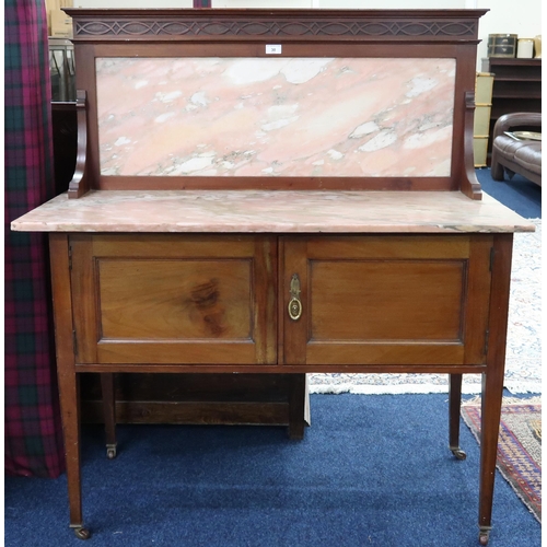 30 - A Victorian mahogany washstand with marble top and splashback over pair of cabinet doors on square t... 