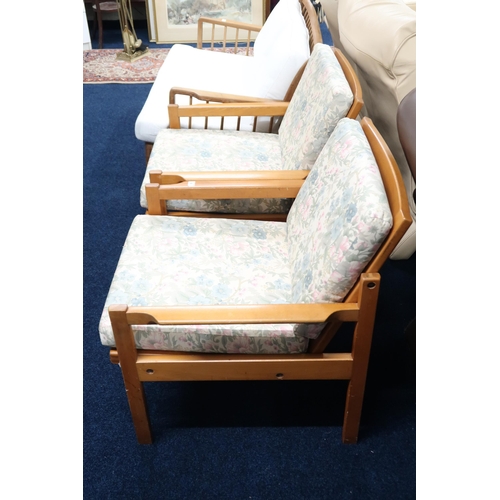 50 - A pair of mid 20th century Centa teak framed armchairs with rail backs and floral upholstered cushio... 