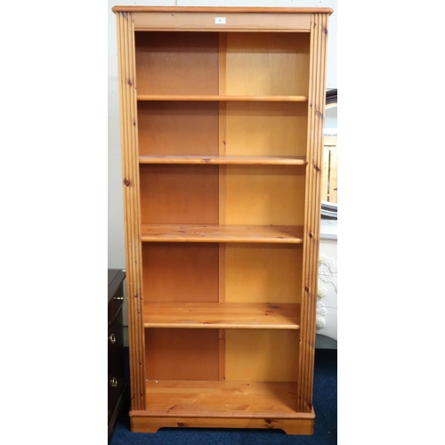 58 - A contemporary pine open bookcase with four adjustable shelves on plinth base, 179cm high x 83cm wid... 