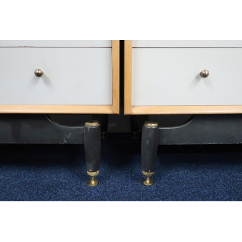 61 - A pair of mid 20th century teak Grange four drawer chests with shaped ebonised supports, 79cm high x... 