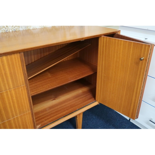 64 - A mid 20th century teak Vanson sideboard with three central drawers flanked by concertina doors on t... 