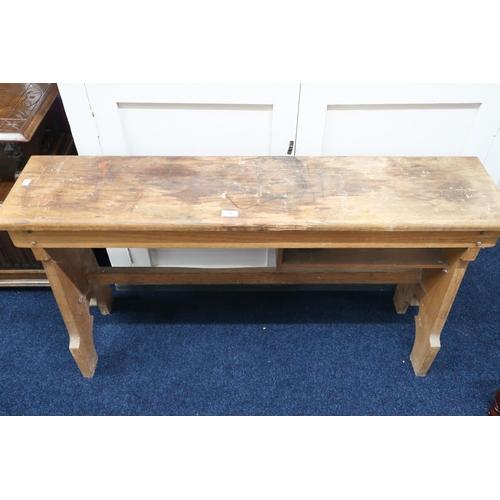 75 - An early 20th century pine refectory bench converted to a telephone table, 66cm high x 124cm wide x ... 