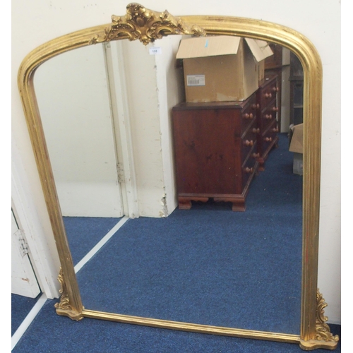 108 - A 20th century gilt gesso style arched overmantle mirror, 126cm high x 122cm wide