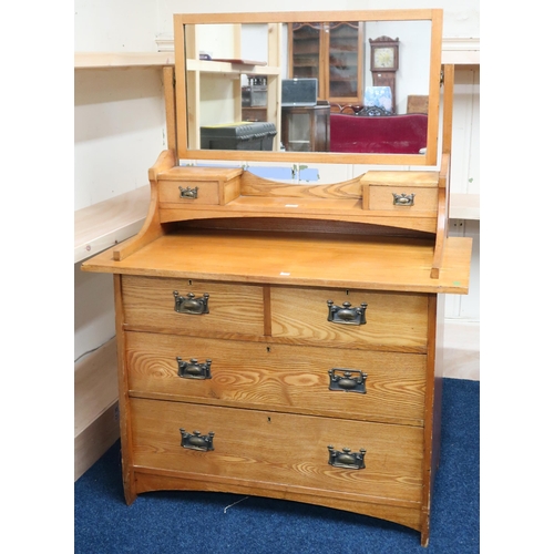 11 - An early 20th century oak Arts & Crafts mirror backed dressing chest with two over two drawers, ... 