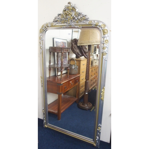 120 - A large 20th century continental style pier mirror with pierced scrolled cherub surmount over bevell... 