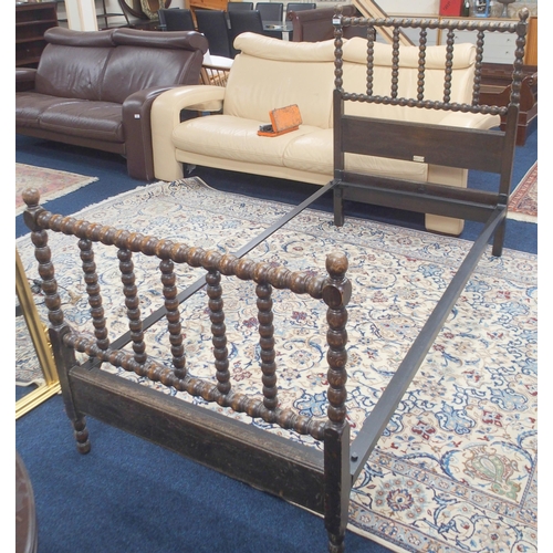 137 - A late 19th/early 20th century oak Heal & Son London single bed with turned bobbin head and foot... 