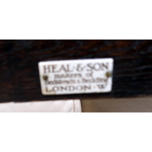 137 - A late 19th/early 20th century oak Heal & Son London single bed with turned bobbin head and foot... 