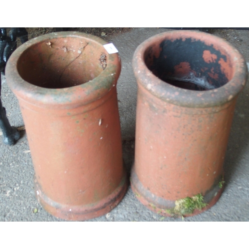 144 - A pair of early 20th century terracotta cylindrical chimney pots, 45cm high x 26cm diameter (2)