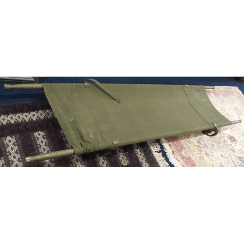 146 - A 20th century green canvas military stretcher