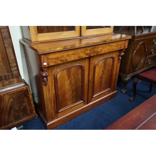 18 - A 19th century mahogany glazed library bookcase with carved architectural style cornice over pair of... 