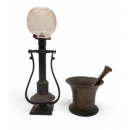 206 - An antique bronze mortar and pestle, 11cm high, together with a ship's lamp, 35cm high (2)