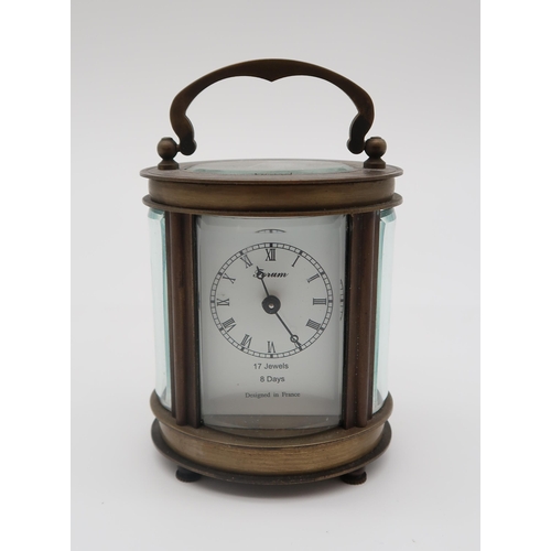 209 - A forum 8 days carriage clock, a pair of cold painted bronze onyx dog bookends, a cold painted bronz... 